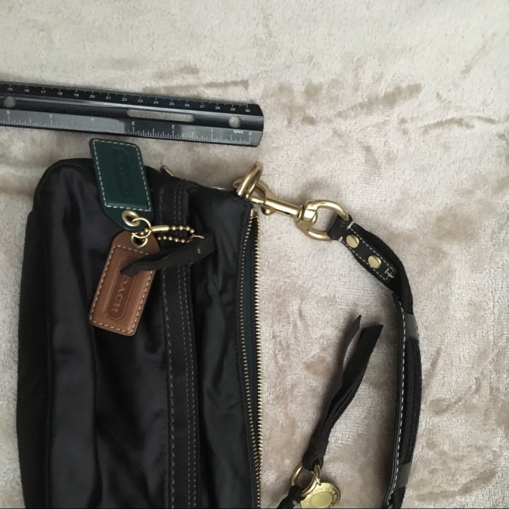 Coach handbag satin like material with charms.